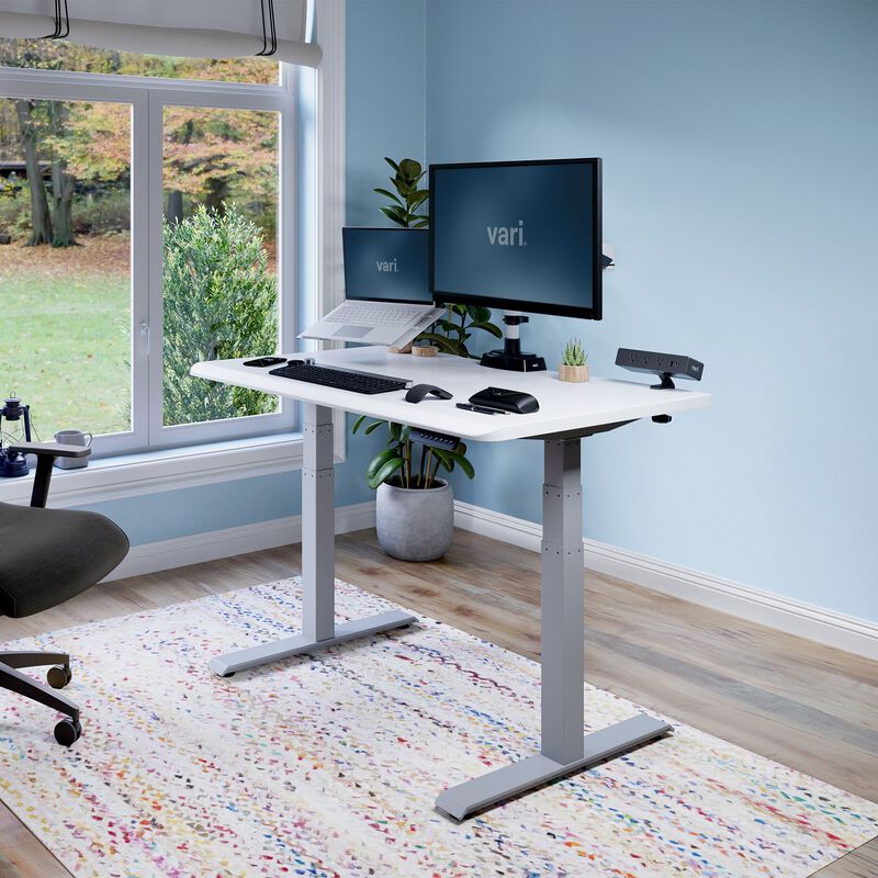 Electric Standing Desk with ComfortEdge in 48x30 White in raised position at home image number null